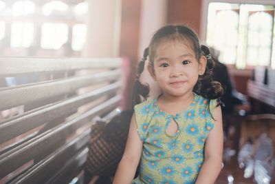 Portrait of cute girl smiling at home