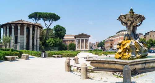 Statue in front of historical building