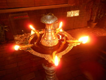 Close-up of illuminated lamp at night