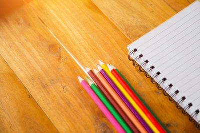 High angle view of colored pencils on table