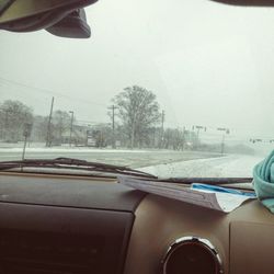 Cropped image of car on road