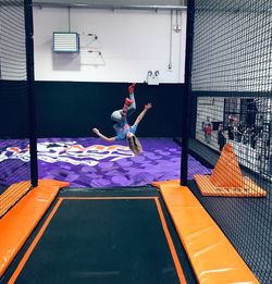 Full length of man jumping at home