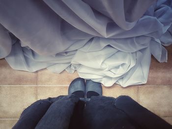 Low section of woman standing on floor