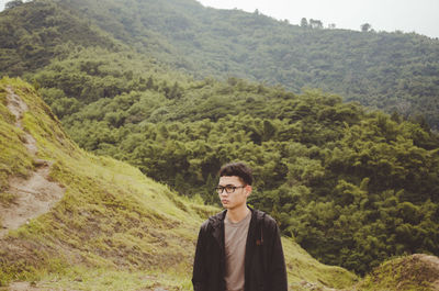 Portrait of man standing on mountain