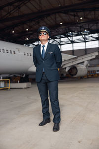 Portrait of man standing in airport