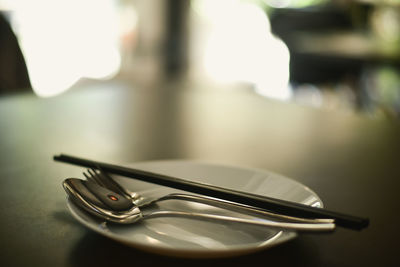 Close-up of electric lamp on table