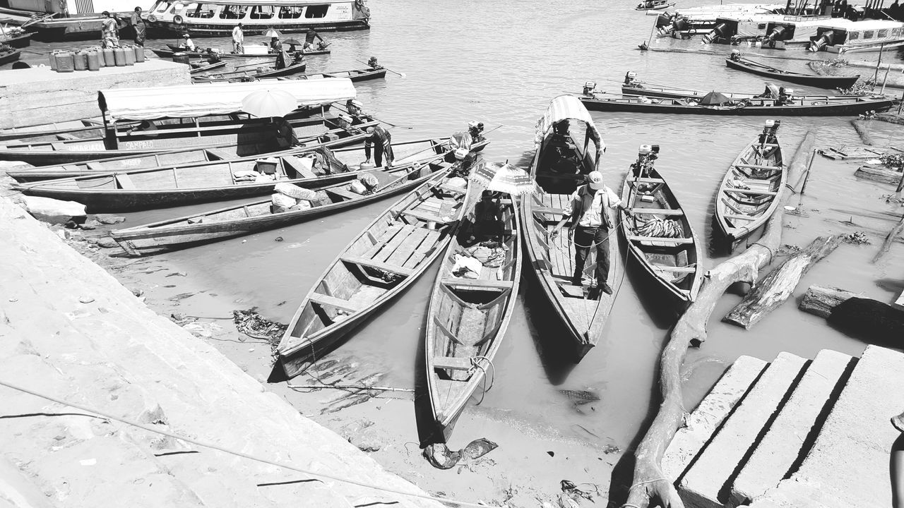 HIGH ANGLE VIEW OF BOATS AT HARBOR