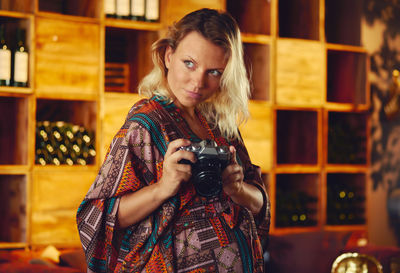 Portrait of woman photographing