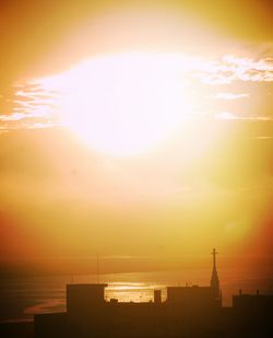 Silhouette of city at sunset