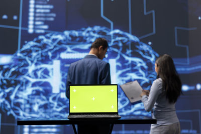Portrait of woman using digital tablet in office