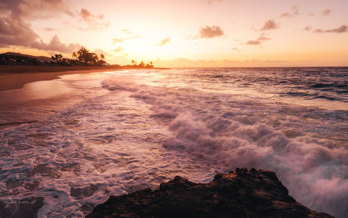 Scenic view of sea against sky during sunset