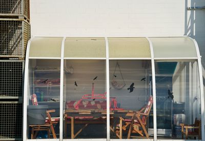 Chairs and table against wall