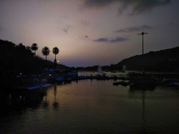 Scenic view of lake against sky at sunset