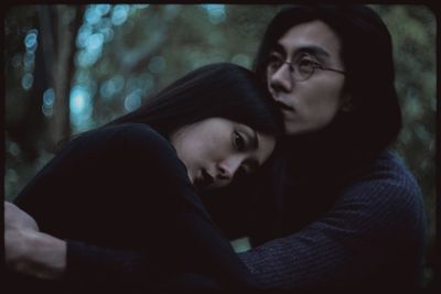 Close-up of couple kissing in city