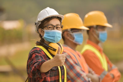 A woman construction worker with hardhat ,portrait of woman architect on construction site person