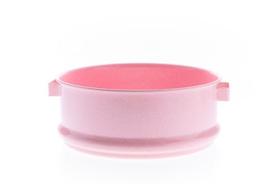 Close-up of pink tea cup against white background