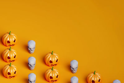 Close-up of christmas decorations against yellow background