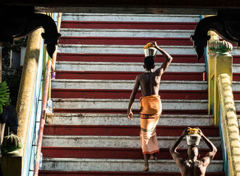 Full length of man walking on stairs