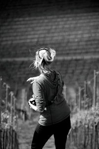 Rear view of woman standing outdoors