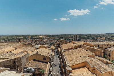 High angle view of buildings in city against sky