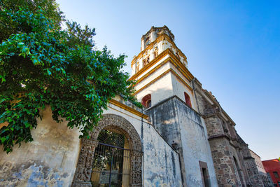 Low angle view of historic building against sky