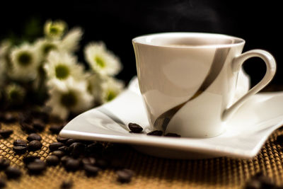 Close-up of coffee cup on table