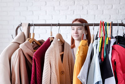 Close-up of clothes hanging on rack