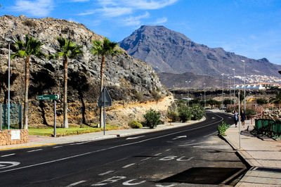 Country road leading towards mountains