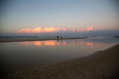 Scenic view of sea against sky at sunset