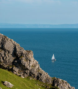 Sailboat on sea against sky