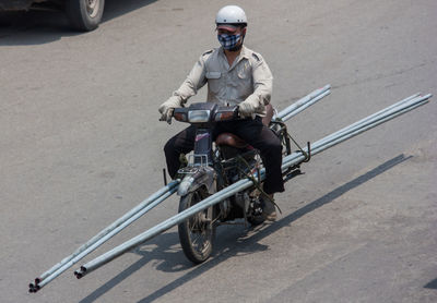 Man riding bicycle on road