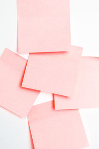 High angle view of pink paper stack on floor