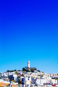 Buildings against blue sky and clouds