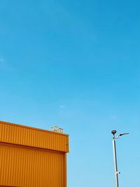 Low angle view of building against clear blue sky