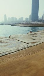 View of cityscape with sea in background