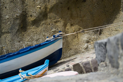 Boats moored against wall