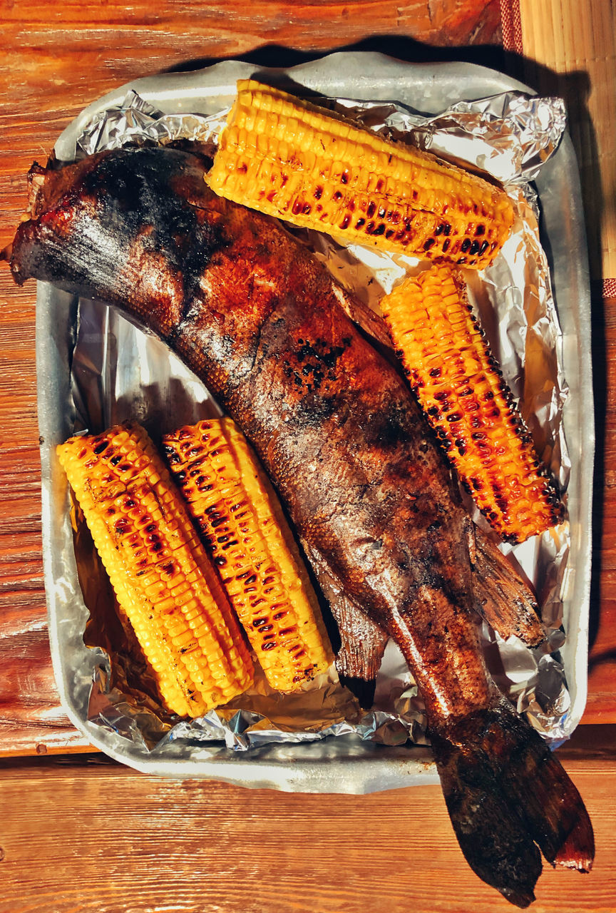 CLOSE-UP OF FISH ON TABLE