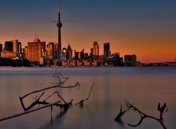 Scenic view of buildings against sky during sunset