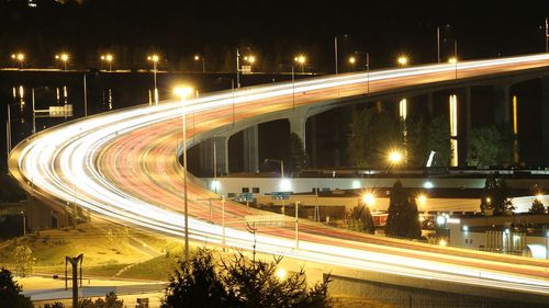 High angle view of light trails on road at night