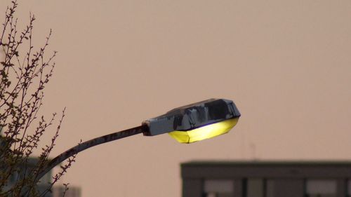 Low angle view of street light against sky