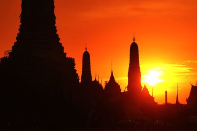 Silhouette temple against sky during sunset