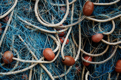 Close-up of blue colored fishing net - fishing net from a fisherman boat