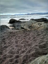 Scenic view of sea against cloudy sky