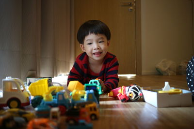 Portrait of cute boy playing at home