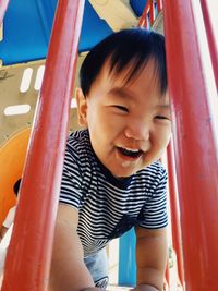 Portrait of cute boy playing in playground