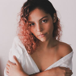 Portrait of woman against white background