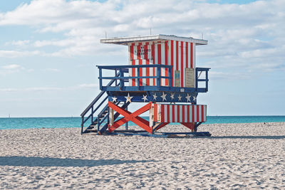 Lifeguard hut on beach against sky at miami beach