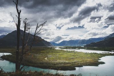 Scenic view of lake and mountains against sky along carretera austral