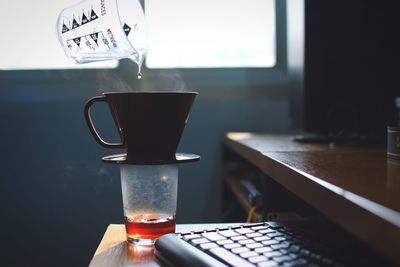 Close-up of coffee cup on table