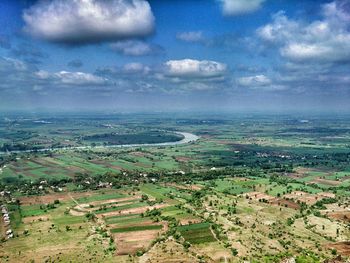 Scenic view of landscape against cloudy sky